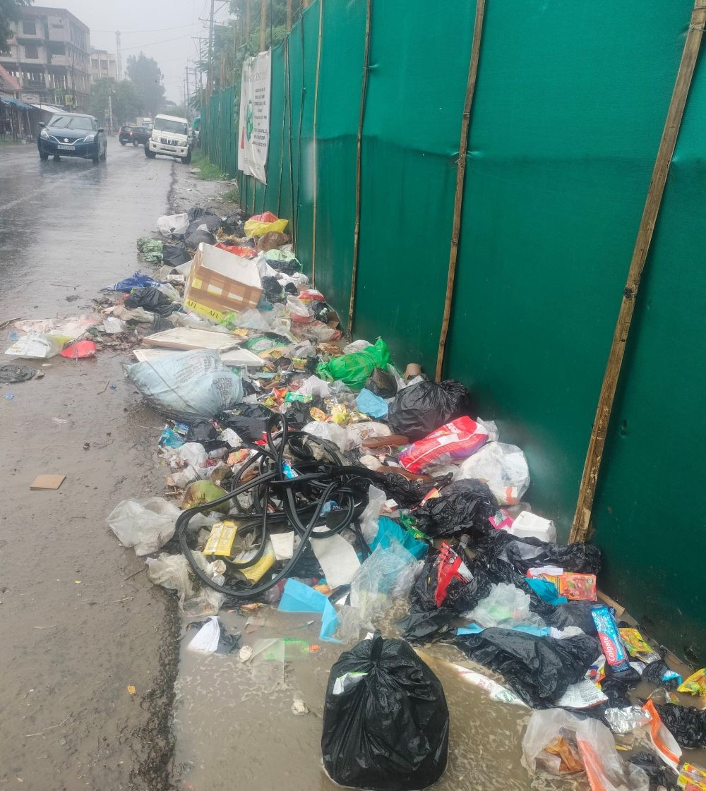 Waste dumped near the wall of Dimapur Government College, adjacent to the office of the Directorate of Food and Civil Supplies.